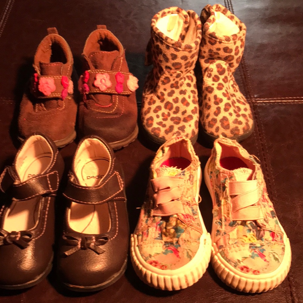 Four pairs of girls size 5 toddler shoes.
